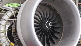 Aviation industry aircraft open engine cover for maintenance and blades of jet turbine rotating by wind. - Powered by Shutterstock - Get 15% off with code: PIKWIZARD15