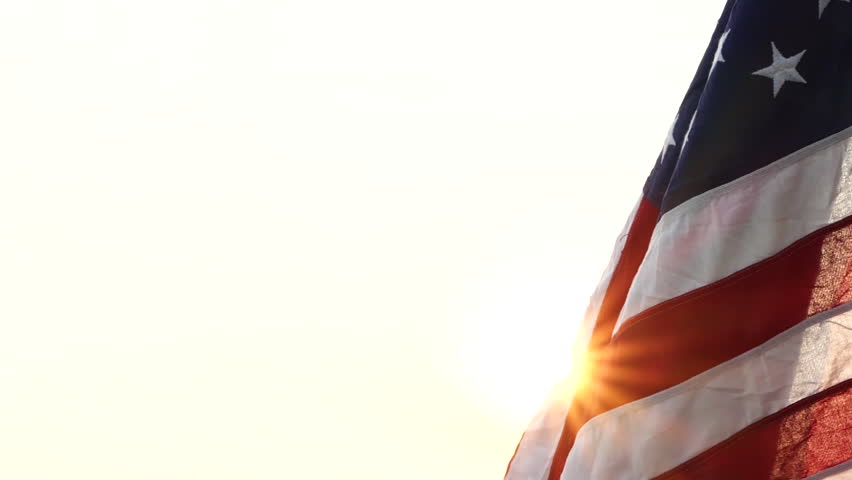 Happy Veterans Day. American USA flag waving against sun in the sky, federal holiday in the United States on November 11, for honoring military veterans of USA Armed Forces. Concept of Veterans Day Royalty-Free Stock Footage #1109336723