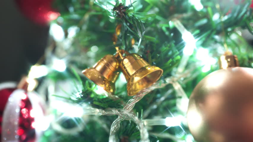 Christmas bells on the Christmas tree with decoration lights