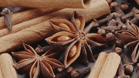 Lots of three spices for mulled wine – star anise, cinnamon and clove slowly scroll clockwise, macro video footage. A great background for your projects. - Powered by Shutterstock - Get 15% off with code: PIKWIZARD15