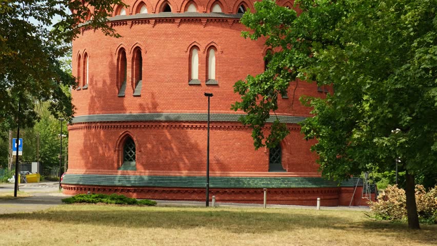 Old brick water tower in Bydgoszcz. The Water Tower in Bydgoszcz, Poland, historic city landmark and viewpoint, Neo-Gothic architecture.