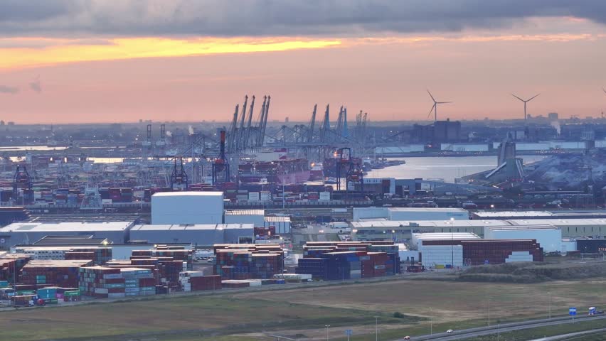 ECT Delta Terminal at Maasvlakte in operation twenty-four hours a day. Golden hour sky