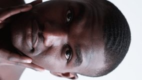 Vertical video. Shave treatment. Male routine. Satisfied confident handsome shirtless man touching smooth face skin after facial moisturizing skincare isolated on white background. - Powered by Shutterstock - Get 15% off with code: PIKWIZARD15