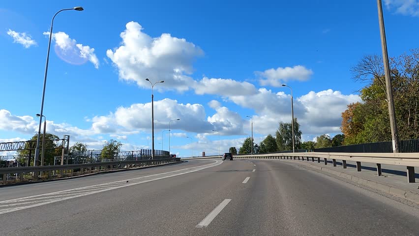 Beautiful nature of Poland autumn. The car is driving on the road Poland.