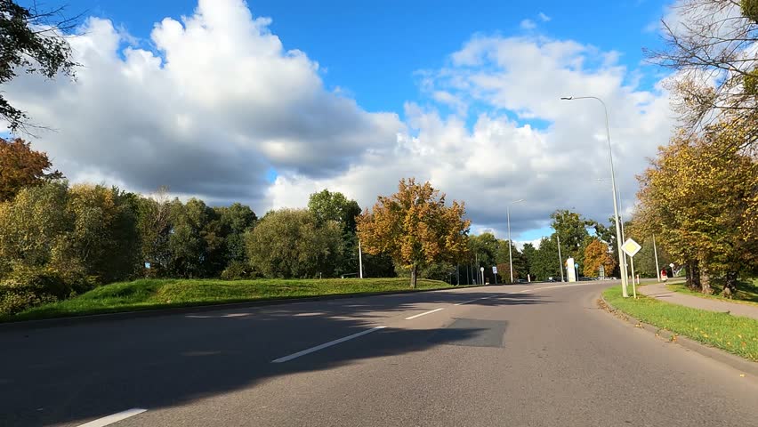 Beautiful nature of Poland autumn. The car is driving on the road Poland.