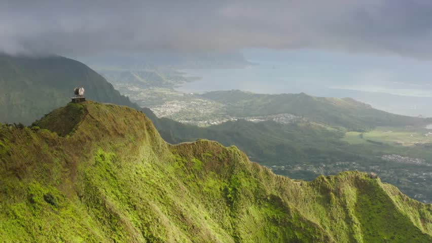 Dramatic views of Stairway to Heaven hike on Oahu island, Hawaii. Aerial view on top of Haiku Stairs. Tourist attraction on Oahu island. Epic green mountain peaks with steep ridge, vertical incline 4K