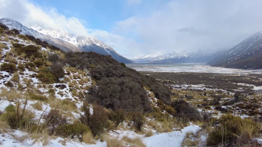 Mt Cook, New Zealand: Footage of the Mt Cook region on the tasman lake and glacier short hike trail with the blue lake in New Zealand south island in winter