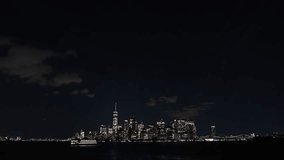 New York skyline during the night. 4K video with the iconic skyline landscape of Manhattan during the night, filmed from ferry. Travel to America.