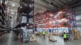 People work in a warehouse timelapse. People work in a large warehouse. Timelapse in a modern warehouse. Work with a modern warehouse - Powered by Shutterstock - Get 15% off with code: PIKWIZARD15