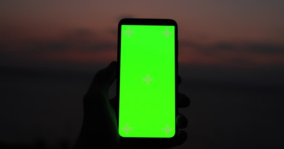 In search of 5G mobile communications, POV male hand holding smartphone with chroma key against dark sky background Royalty-Free Stock Footage #1109365211