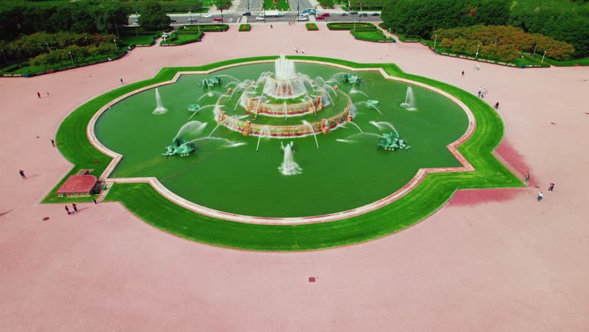 lowering aerial shot of Chicago. Buckingham Memorial Fountain. Beautiful drone shot above Grant Park. Copy Space - room for text above. Cinematic establishing opener. Midwest Illinois USA