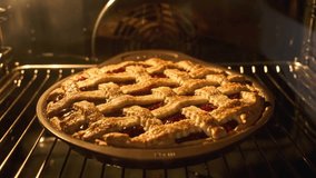 Tasty pie in oven. Timelapse of homemade pie baked. Baking concept. Delicious Apple Pie rising up in oven. Process of baking berry pie with apples baked in oven. 4K, UHD - Powered by Shutterstock - Get 15% off with code: PIKWIZARD15