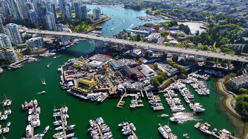 Boats And Ferry Terminals With Granville Island In Vancouver, British Columbia, Canada. - aerial