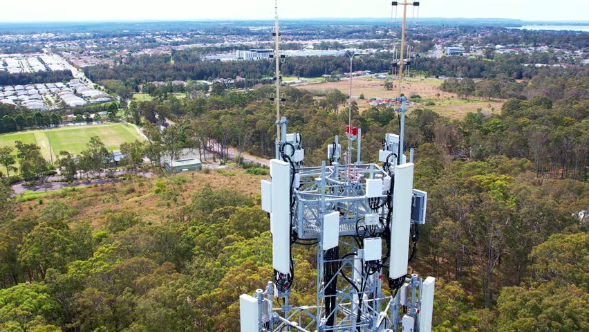 Aerial view of Australian telecom towers. Drone footage captures the expansive network, showcasing Australia's tech landscape from a sky-high perspective Royalty-Free Stock Footage #1109377957