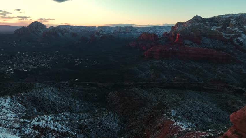 Flying Over The Sedona Landscape During Sunset In Winter. - aerial