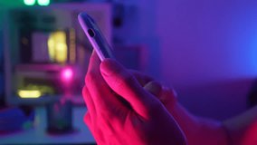 Close-up side view of unrecognizable man watching and read news on smartphone, scrolling up and down, tapping, zoom in and out. Closeup of male browse web page or app on magazine portal, slow motion. - Powered by Shutterstock - Get 15% off with code: PIKWIZARD15