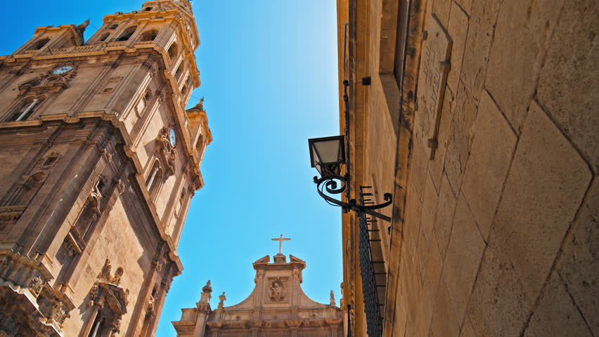 Catedral de Murcia Roman Catholic church with Baroque design and Gothic style. Beautiful Spanish Tower with a clock a famous tourist attraction in the University City of Murcia in Spain, Europe