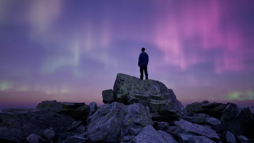 Man Standing on Peak with Magical Mountain Scene in Nature at night with Aurora in the sky. 3d Rendering landscape. Aerial