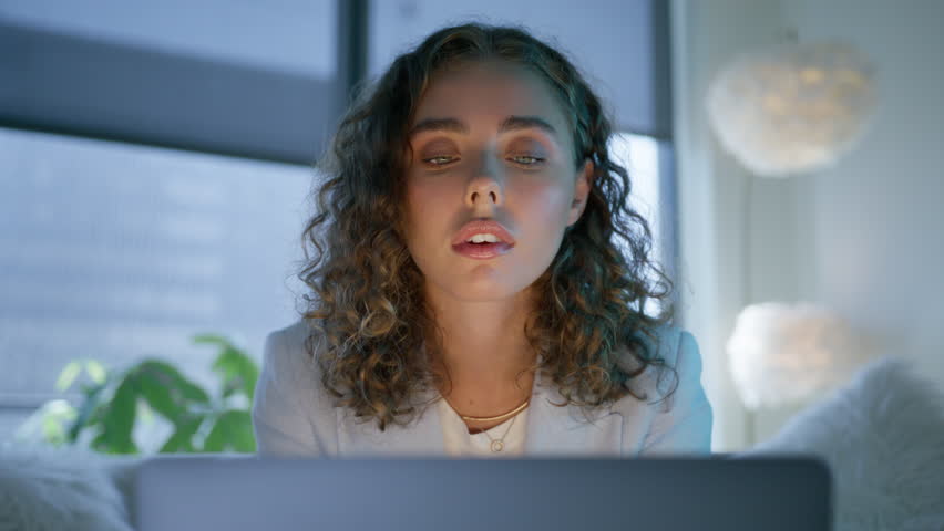 Close up portrait view of motivated girl reads good news in email, happy about victory. Excited young woman looks at laptop celebrates online success win. Euphoric lady gets new remote job opportunity Royalty-Free Stock Footage #1109388305