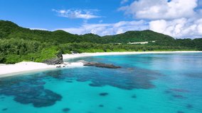 Aerial Furuzamami Beach on Zamami island, Kerama the closest island chain to Naha in Okinawa, Pacific ocean, Japan. Tourism and marine national parks. Pristine reefs. INTERPRET footage for SMOOTH