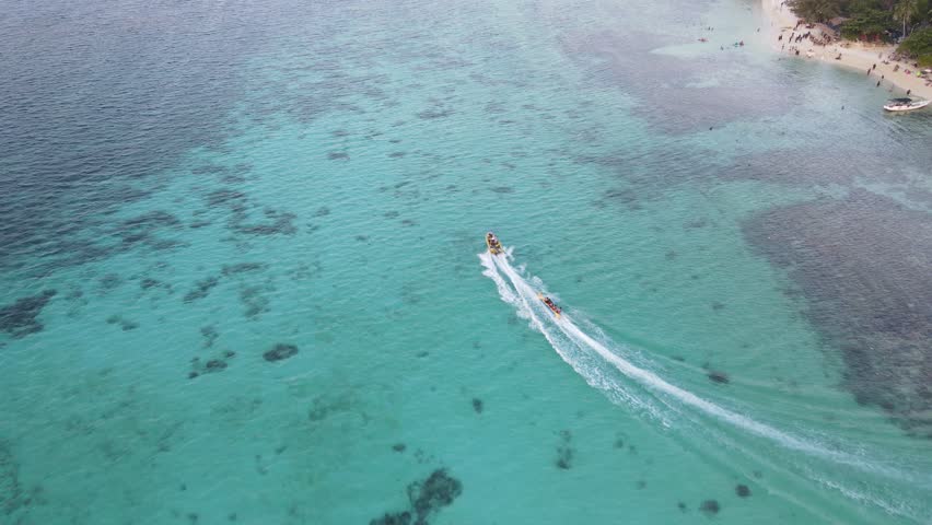 Aerial view of speedboat in shallow water. Travel and leisure activities concept Royalty-Free Stock Footage #1109393589