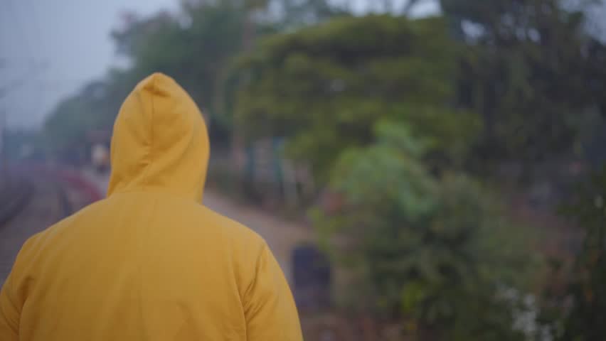in winter a boy walking alone in the morning