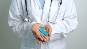 Blue November Prostate Cancer Awareness month, Doctor with Blue Ribbon in hospital for support people life and illness. Healthcare, International men, Father, Diabetes and World cancer day - Powered by Shutterstock - Get 15% off with code: PIKWIZARD15