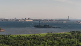 Establishing Aerial View Shot of New York City NY, NYC, United States, Statue of Liberty, circling left