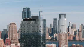 Establishing Aerial View Shot of New York City NY, NYC, United States, lower Manhattan, downtown, circling right, reveal from the buildings, Hudson River, close