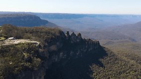 Aerial drone view of Echo Point Lookout and the Three Sisters rock formation at Katoomba in the Blue Mountains region, New South Wales, Australia on a sunny day in September 2023    - Powered by Shutterstock - Get 15% off with code: PIKWIZARD15