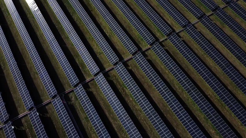 Solar panels reflects sun during sunset in Calgary, Alberta. Royalty-Free Stock Footage #1109406759