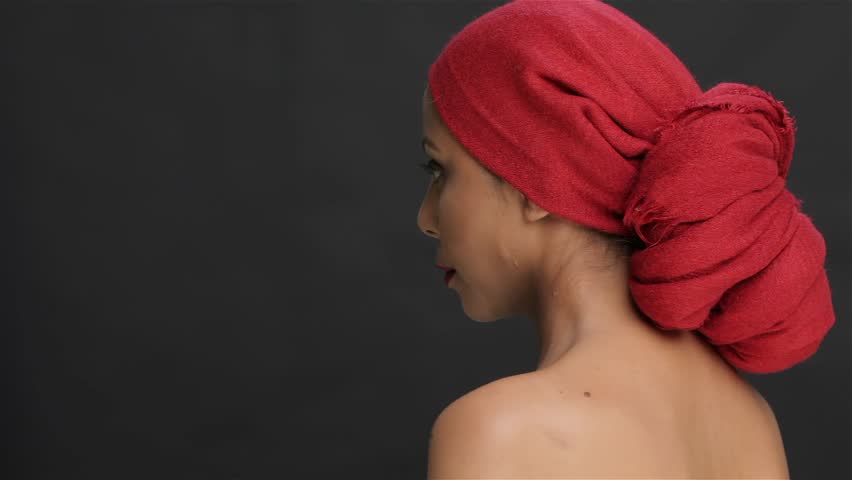 The girl in a red scarf turns