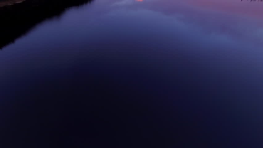 Aerial Tilt Up Shot Of Lake With Trees Near Snowcapped Mountain, Drone Flying Backward Natural Landscape Against Sky At Dusk - Portland, Oregon