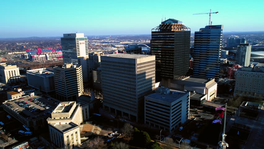 Aerial Ascending Forward Towards Tennessee State Capitol Near Modern Buildings In City Against Sky - Nashville, Tennessee