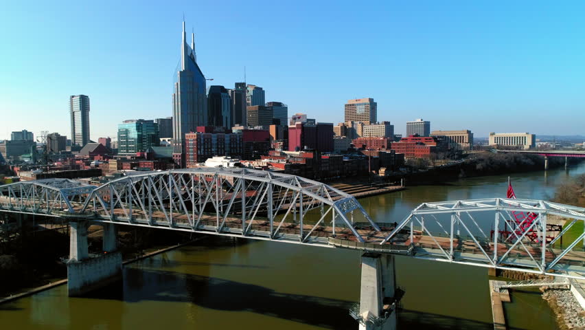 Aerial Forward Shot Of Bridge Over Cumberland River Near Buildings In City - Nashville, Tennessee Royalty-Free Stock Footage #1109415165