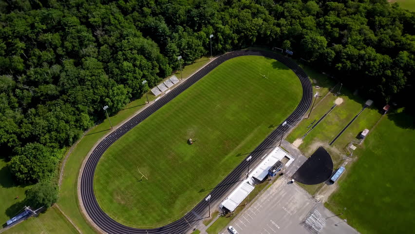 Aerial Shot Of People In Green Sports Field By Trees On Sunny Day - Boston, Massachusetts