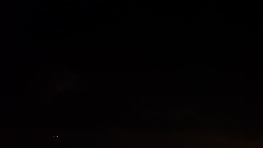 An airplane taking off at night amid lightning flashes Royalty-Free Stock Footage #1109417175