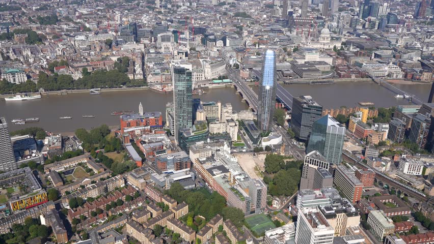 Aerial view of the South Bank, London, from Blackfriars and the Tate Modern to Southwark and London Bridges and a view of the City of London towers. London, UK Royalty-Free Stock Footage #1109422857