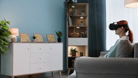 modern technology, young woman in viar glasses with friends using virtual reality video call while standing in a cozy room - Powered by Shutterstock - Get 15% off with code: PIKWIZARD15