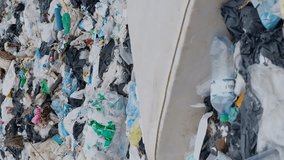 A mountain of plastic garbage. The problem of environmental pollution with garbage. Vertical video