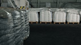 Grain stacked, Harvest Distribution, Bagged Harvest. Harvest has yielded numerous bags of products stored in company's plant warehouse. - Powered by Shutterstock - Get 15% off with code: PIKWIZARD15