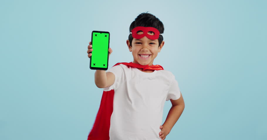 Child, game and portrait with phone green screen for superhero, justice or happy mockup with ux tracking markers. Kid, super hero and smartphone with mock up space and vigilante, costume and games Royalty-Free Stock Footage #1109430237