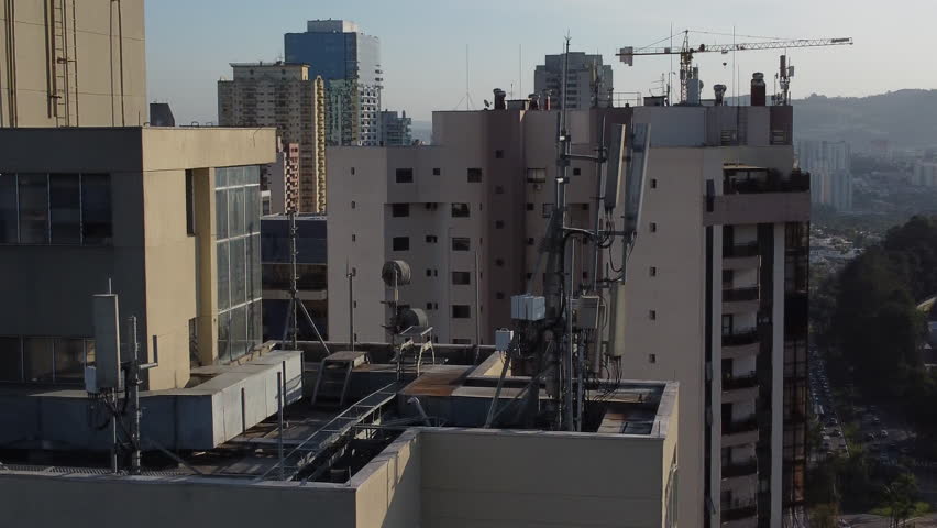 Flying By Communication Antenna On Top Of a Building
