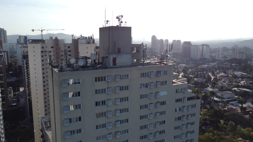 Flying By Communication Antenna On Top Of a Building