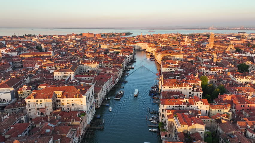 Venice sunrise skyline, aerial view of the Grand Canal, golden hour, gondolas, boats, Venetian Lagoon, Italy Royalty-Free Stock Footage #1109444371