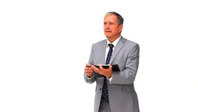 Elderly businessman taking notes isolated on a white background - Powered by Shutterstock - Get 15% off with code: PIKWIZARD15