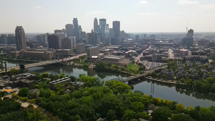 Orbital Panoramic Aerial View Of Downtown Minneapolis, Minnesota With the Mississippi River Running Through In the United States.