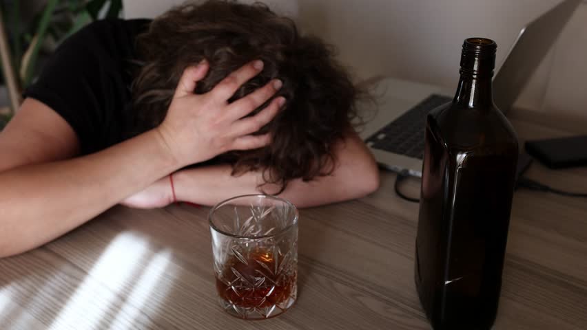 alcoholism, alcohol addiction . drunk woman or female alcoholic drinking whiskey at home. Loneliness and stress. Female alcoholism Royalty-Free Stock Footage #1109460849