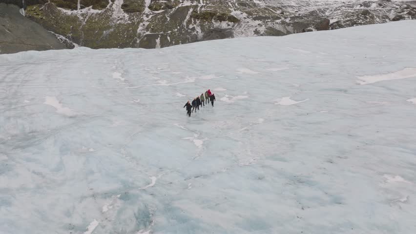Aerial view of people hiking on the ice surface of Virkisjokull glacier, Iceland
