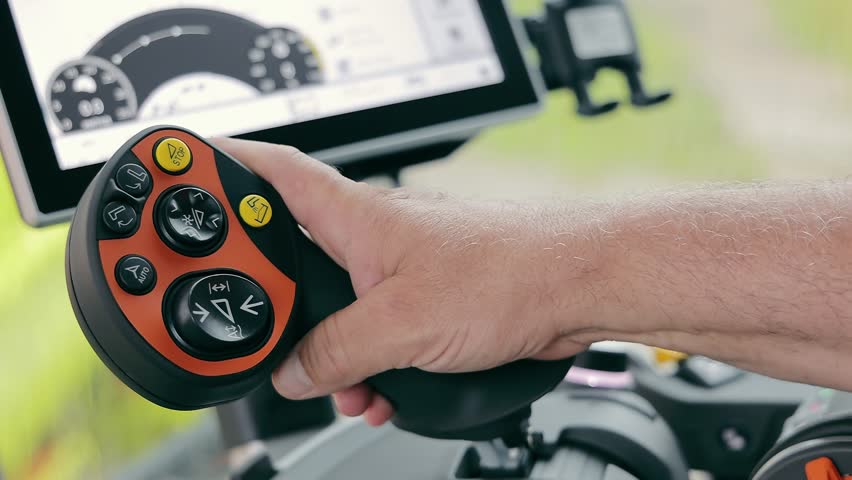 Combine harvester control joystick. The combine pulls the joystick lever towards itself.